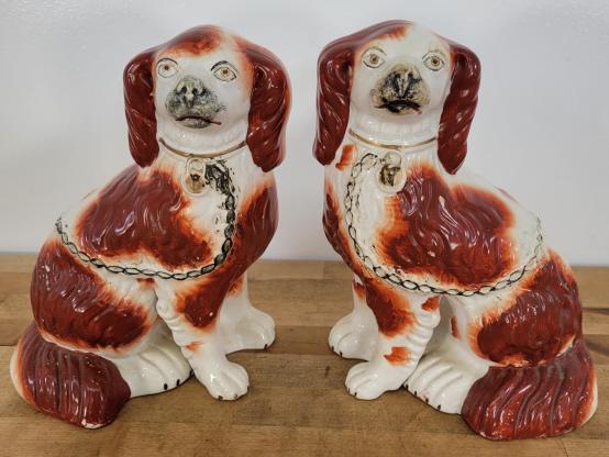Pair of Staffordshire Porcelain Dogs: Description: This lot includes a pair of white porcelain Staffordshire dog figures. These appear to be antique / Vintage in age, though exact age is unknown. Unmarked Condition: Minor expected surface