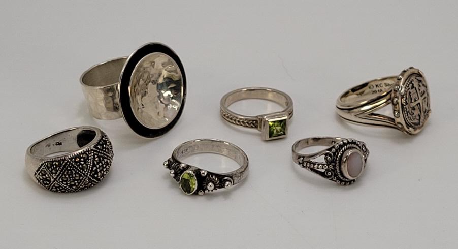 6pc. Vintage Sterling Silver Rings: Description: This lot includes six vintage sterling silver rings. Each ring is marked sterling, some are maker signed. See photos for details. Condition: Pieces are in estate found condition, with min