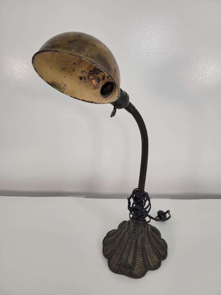 1920s Industrial R.B. Co Gooseneck Desk Lamp: Description: This lot includes a early 20th century Gooseneck desk lamp with a Art Neuvo style cast iron base. The base is marked on the underside with makers mark. Condition: Expected surface wear as