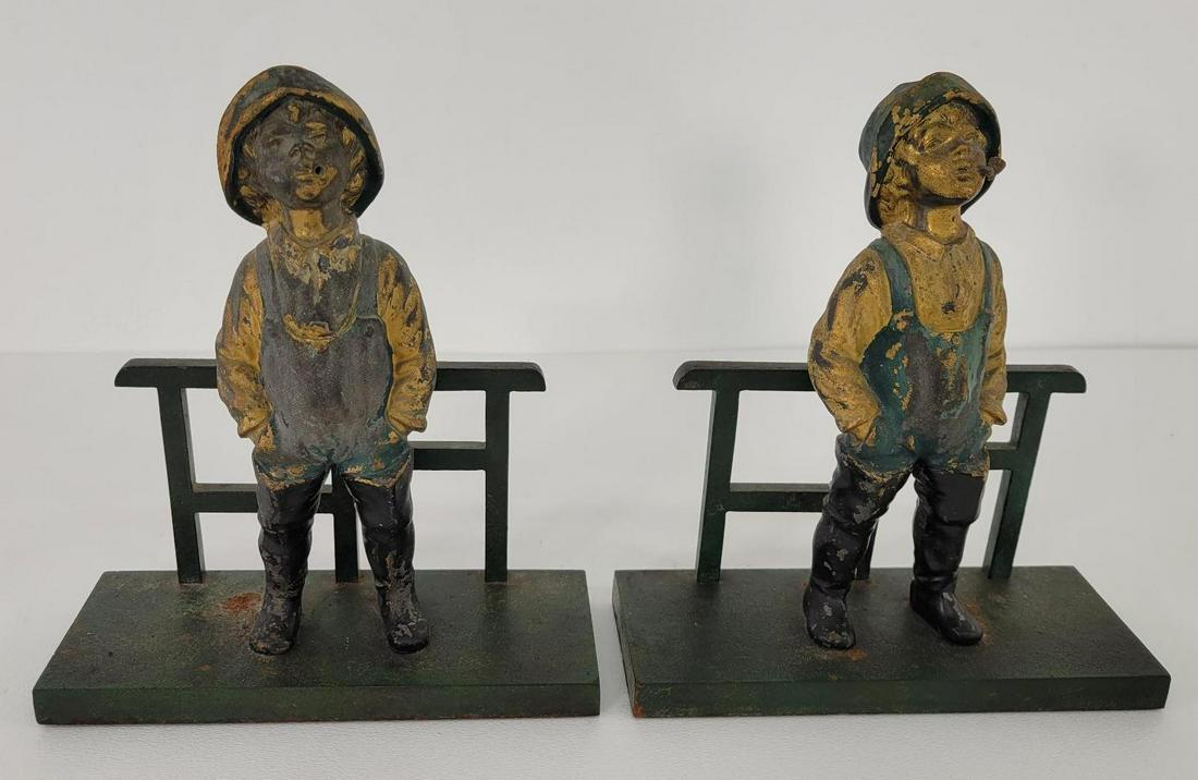 Bradley & Hubbard Cast Iron Sailor Boy Bookends: Description: This lot includes a pair of original late 19th century cast iron bookends made by Bradley & Hubbard as indicated by their mark on the back. The bookends are in the form of the classic Sai