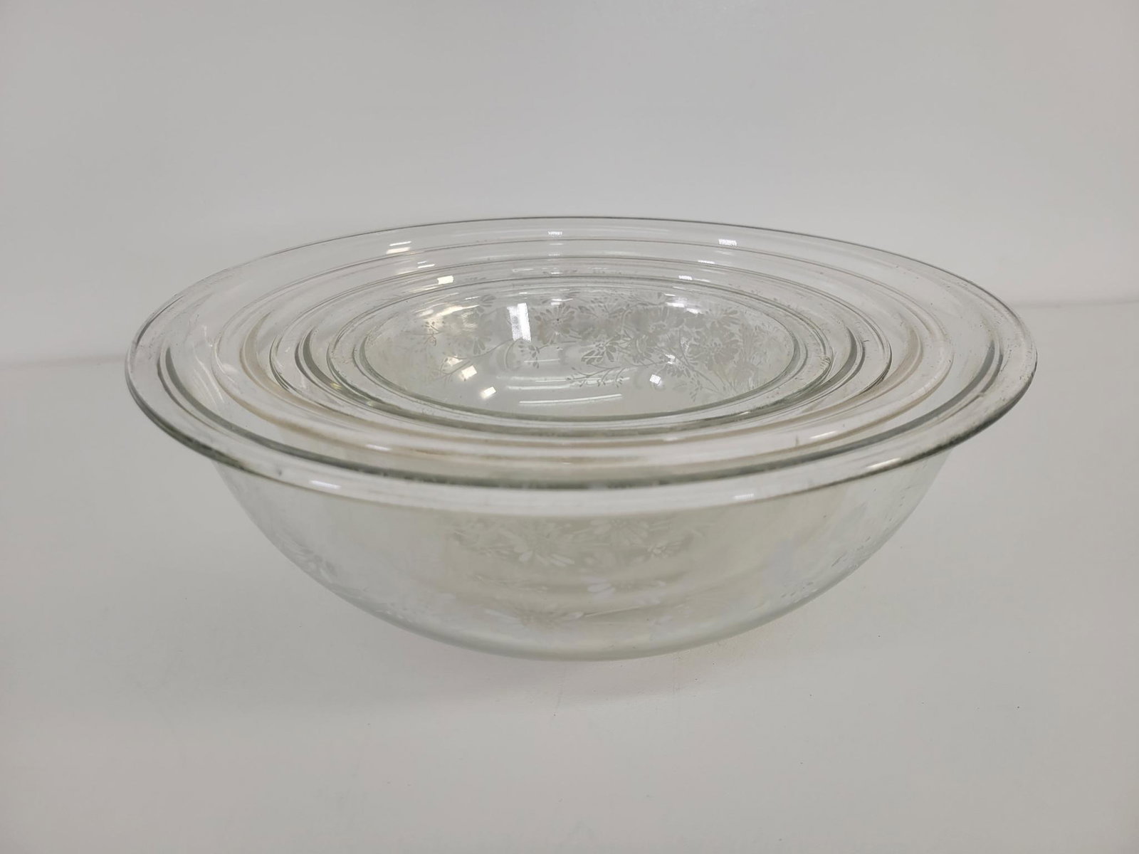 Pyrex Mixing Bowl Set: Description: This lot includes a set of Pyrex mixing bowls. Finish is original, and lightly worn as expected. Condition: Minor expected surface wear associated with age and use, otherwise in overall g