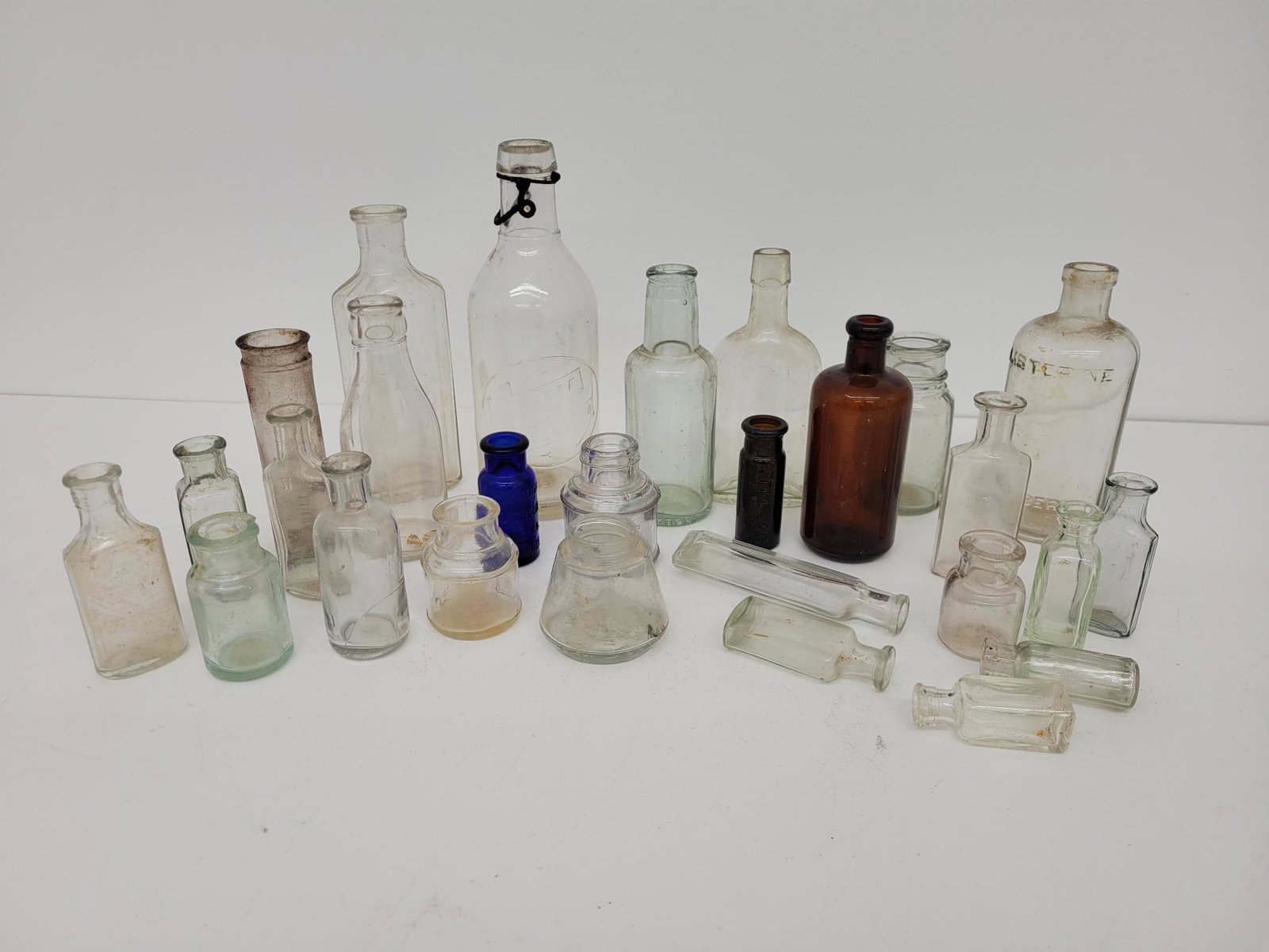 Estate Lot of Antique Bottles: Description: This lot includes a small estate grouping of antique and vintage bottles. You get everything you see in the photos. Condition: Conditions range from good to lightly damaged, with most bei