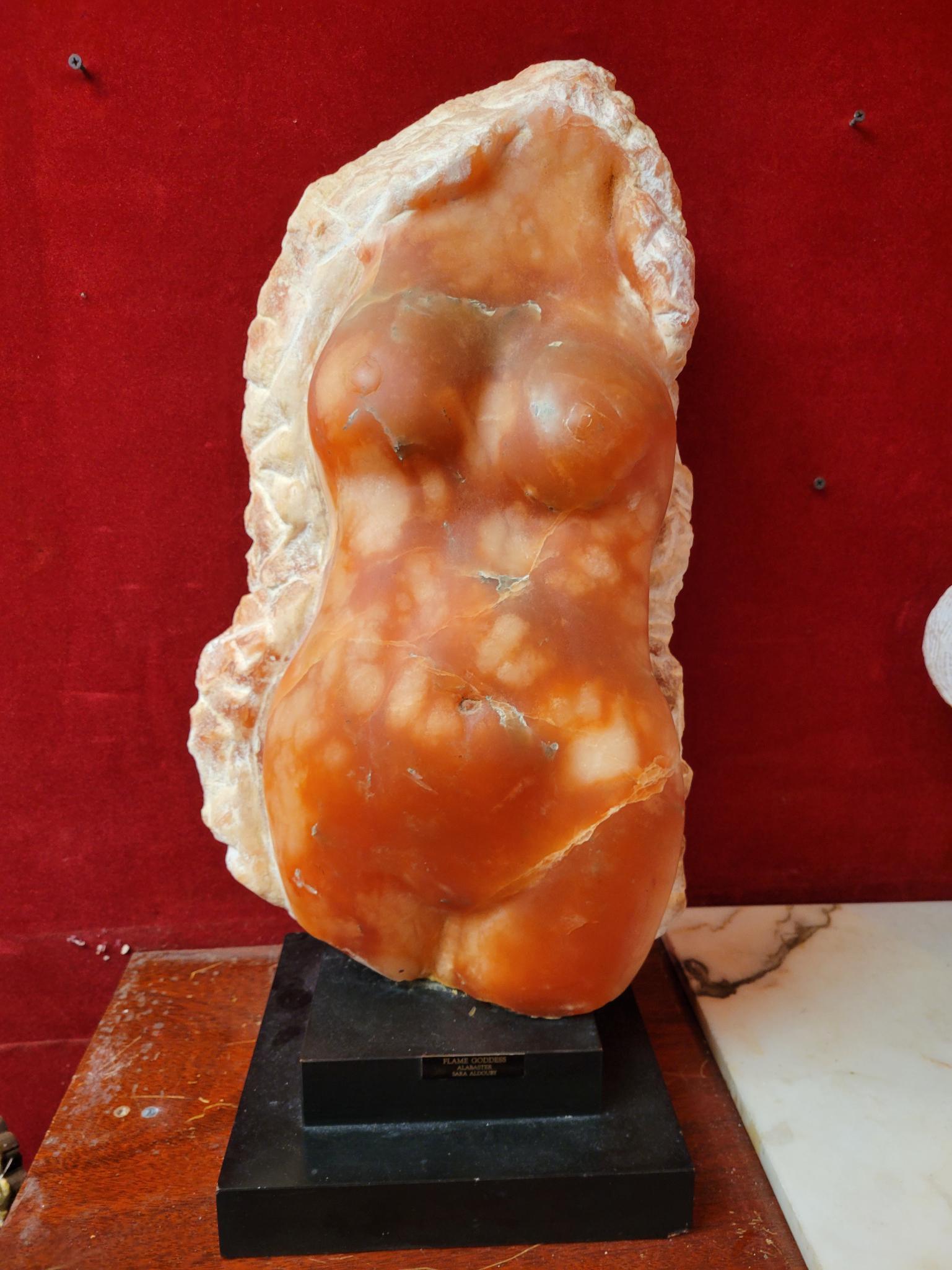Sara Albouby "Flame Goddess" Carved Alabaster: Description: This lot includes a carved alabaster sculpture by "Sara Albouby" titled "Flame Goddess" Condition: Minor surface wear associated with age and use, otherwise in overall good antique condit