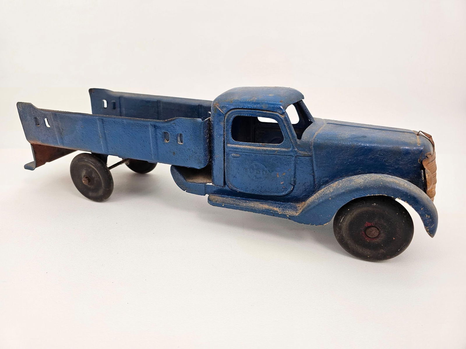 Buddy L Pressed Steel Truck: Description: This lot includes a pressed steel truck made by Buddy L. The truck appears to be in original condition with original paint but is well played with and a little worn. For an in-depth under
