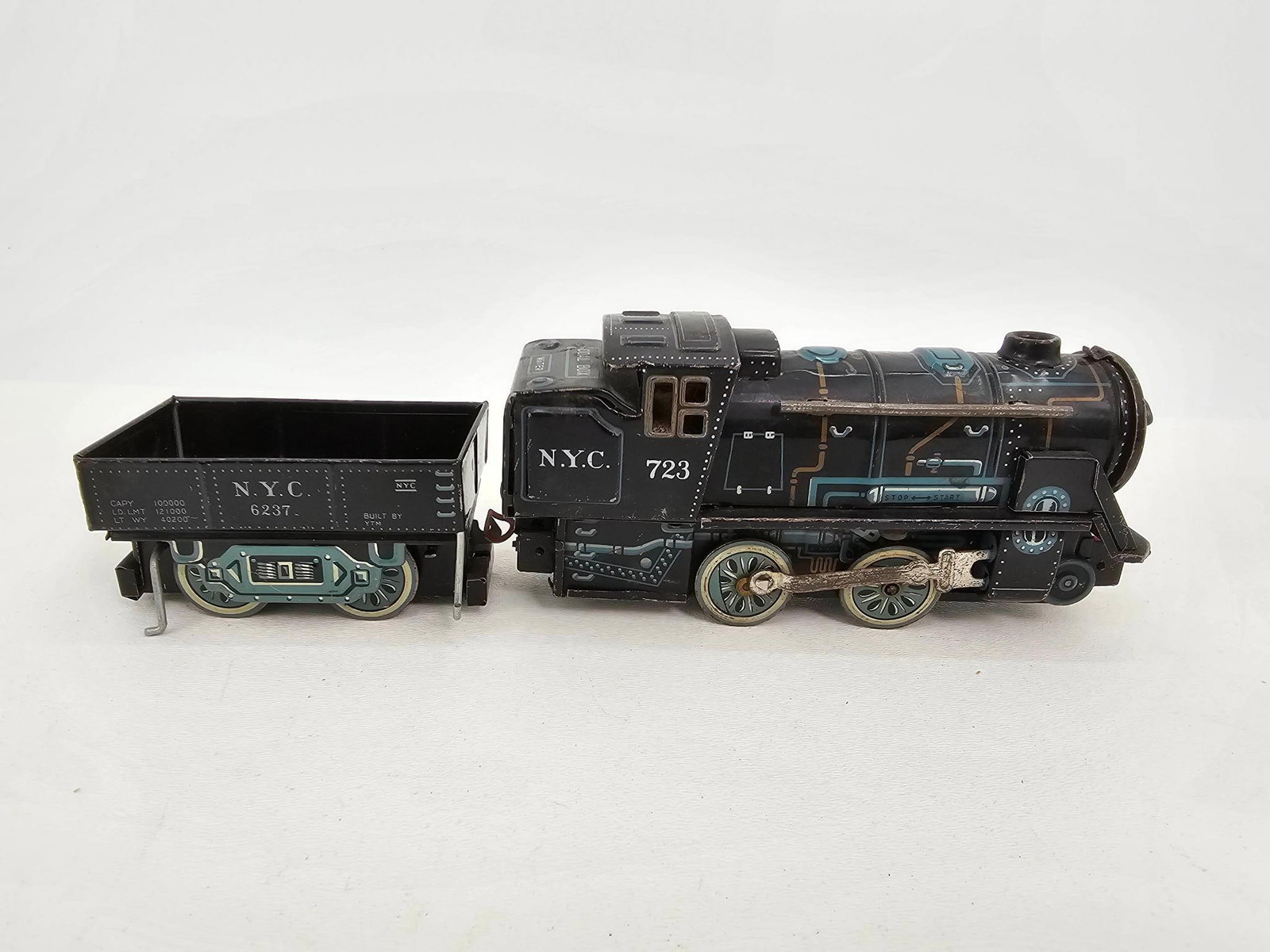 1950's Tin Lithograph Alps Japan Train Engine: Description: This lot includes a 1950's Battery powered tin lithograph train engine by Alps Japan. The train is in good original vintage condition with expected paint and finish loss from age and 