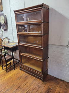 F.E. Hale Mfg. Co Barrister Bookcase - 5 Stack: Oak framed with brass hardware. Includes 3 sized sections all with original glass doors. There is some damage to the right side of the cabinet mainly on the lowest most section (See photos) Measureme