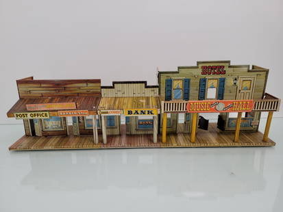 Marx Roy Rogers Mineral City Tin Litho Toy: Set is in overall good condition with only minor bends to the metal and slight paint loss and scratches. Lot only includes the building, does not have any extras. Measurements: 27"L x 6"W x 9.5"H