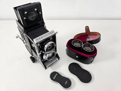 Mamiya C33 Professional w/ Extra Lens: The camera comes out of a professional photographers estate. Overall looks to be in great vintage condition and well kept. Functionality unknown as we cannot test the camera. Includes 2 lenses, one in