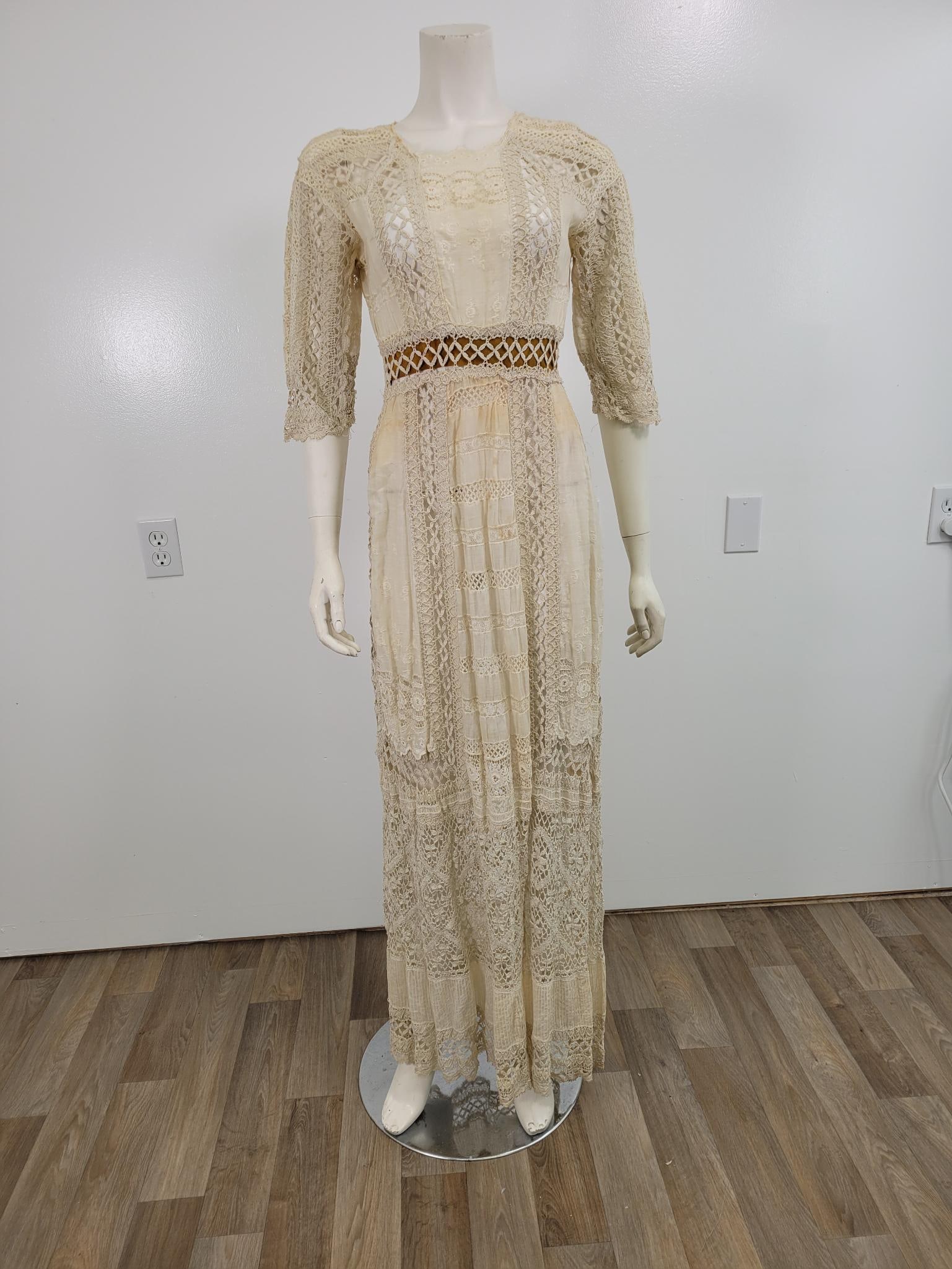 Boho/Victorian Style Lace Dress: Description: Appears to be antique lace, boho/Victorian full length dress with zipper in the back. Off white, some wear and light staining. Measurements: Shoulders 18" Waist 16" Sleeves 13.5"