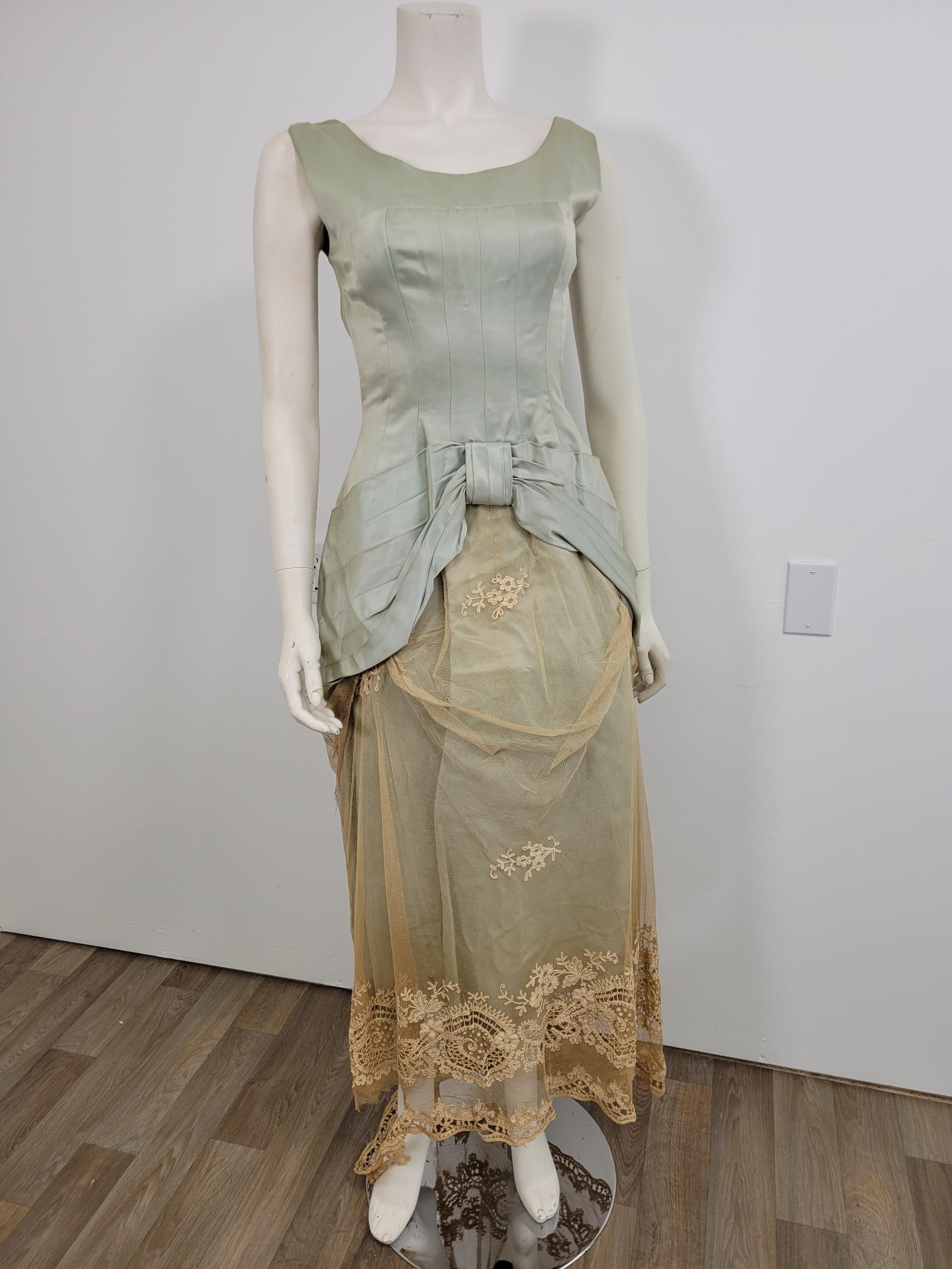 Seafoam Party Dress: Description: Seafoam princess party dress, could be 50s or 60s. In need of repair, lace along bottom torn (see photos) some wear and tear. Measurements: Shoulders 17 Chest 28/16 across Waist 26 Hips 3