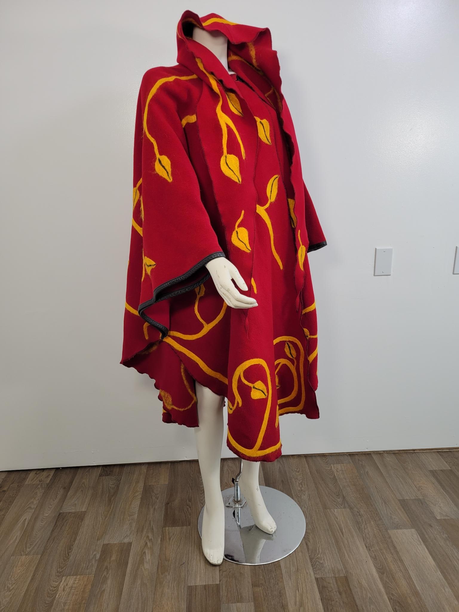 Vintage Harve Bernard Poncho Style Jacket: Description: Vintage Harve Bernard poncho style coat with hood and leather details. Two button closure at the neck. No rips or stains. Measurements: One Size