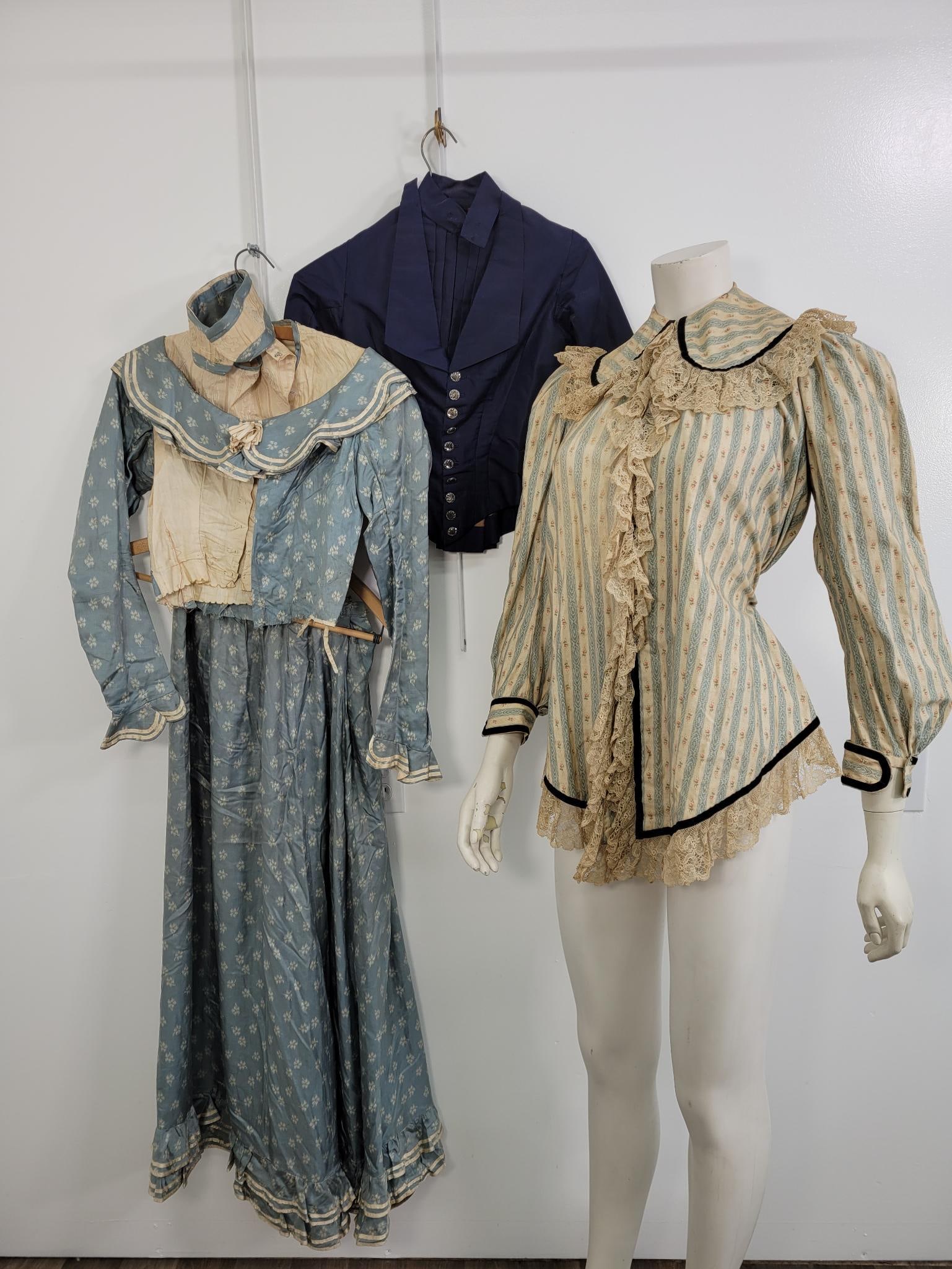 Four Piece Blue Victorian Style Lot: Description: Light blue shirt and skirt set have heavy tearing and staining. Dark blue top is in good shape, has some stitching that?s come loose but not torn with beautiful metal buttons. Light blue 