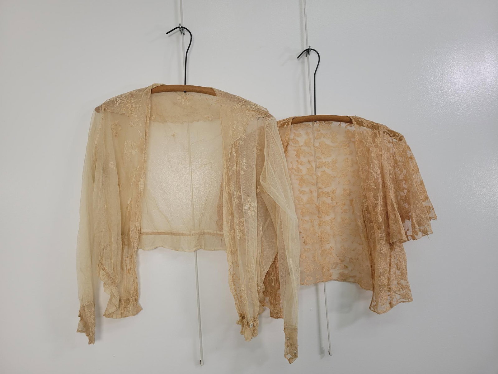 Pair Of Antique Lace Tops: Description: Antique lace tops. One with long sleeves and lace collar. Is overall discolored but not ripped. Lace shrug has some pulling threads but no rips or stains. Measurements: one size