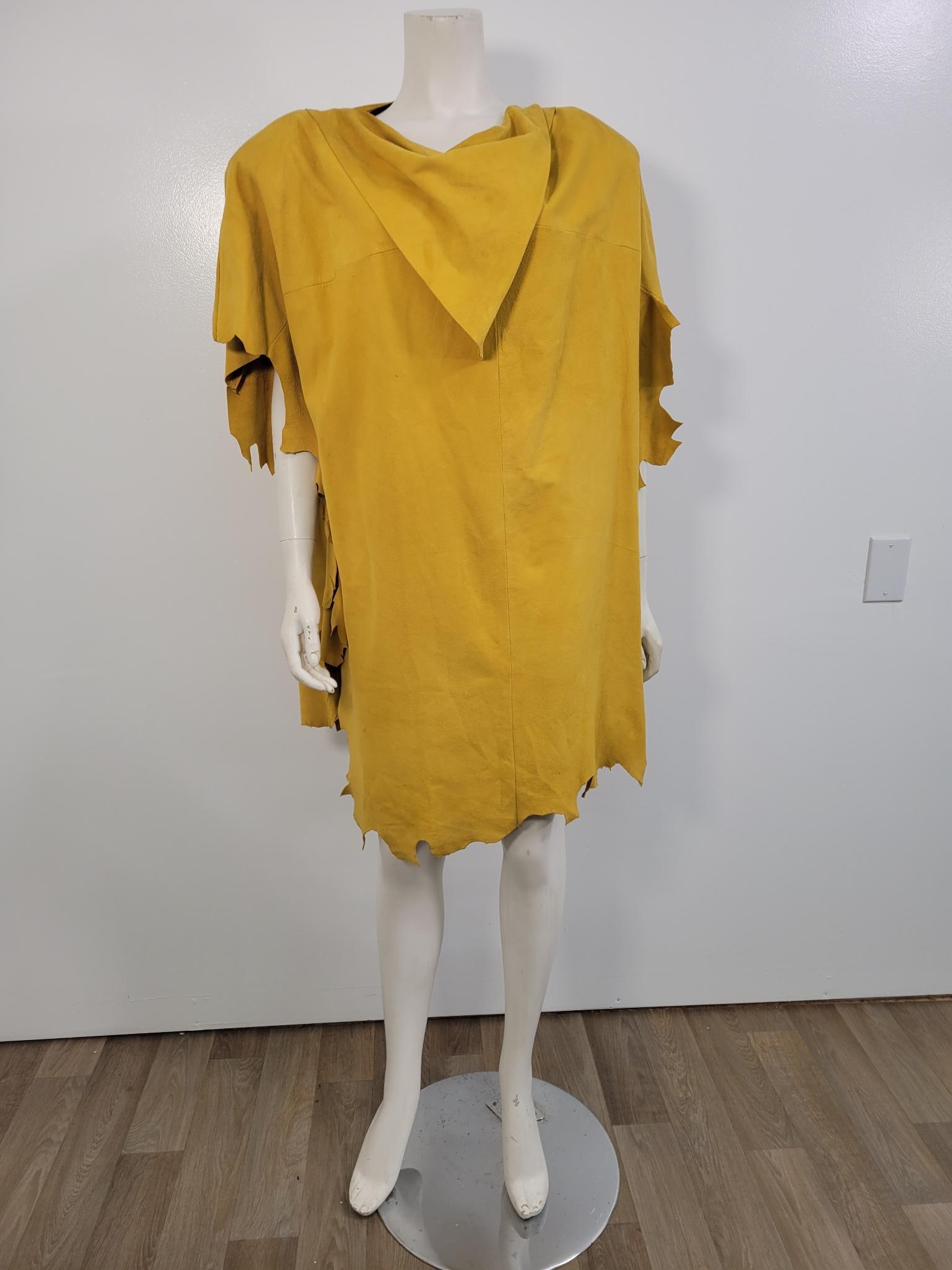 Vintage Mustard Yellow Suede Poncho: Description: Mustard yellow suede poncho. No label, some discoloration around neckline, no rips or other stains (see photos) Has some sizeable shoulder pads that can be removedMeasurements: One size