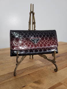 Prada Gator Wallet: Description: Looks like a Prada "gator" skin wallet. The emblem is coming off in one corner (see photos) Measurements: 7.5" x 4"