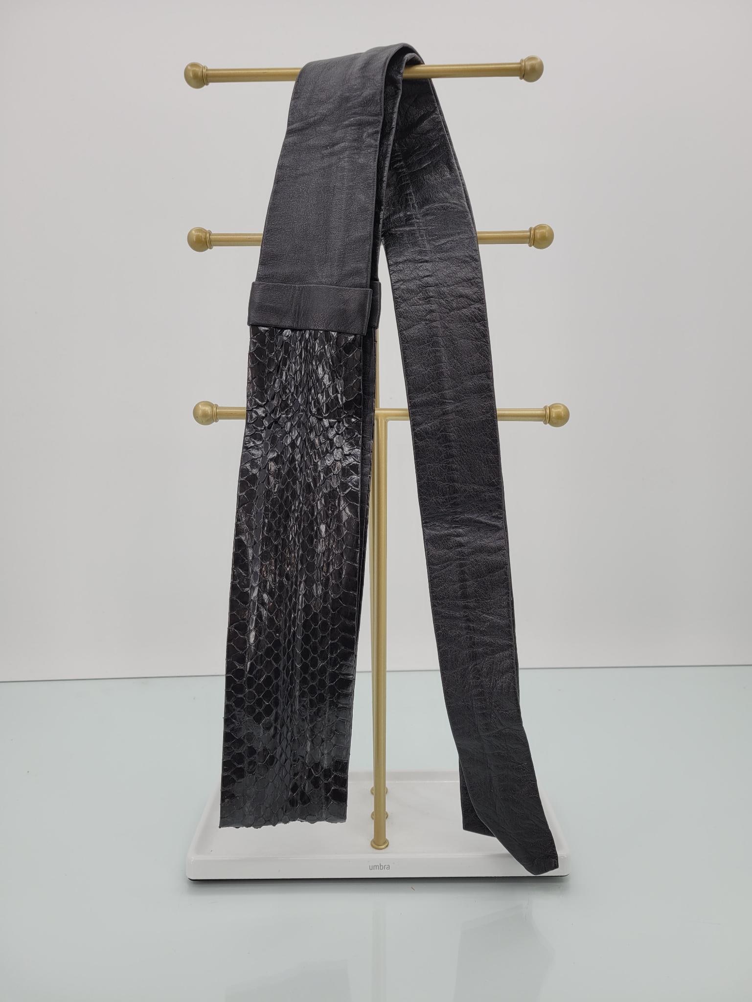 Vintage Black Leather And Snakeskin Wrap Belt: Description: Vintage black leather and snakeskin wrap belt. No tears or stains Measurements: 76"