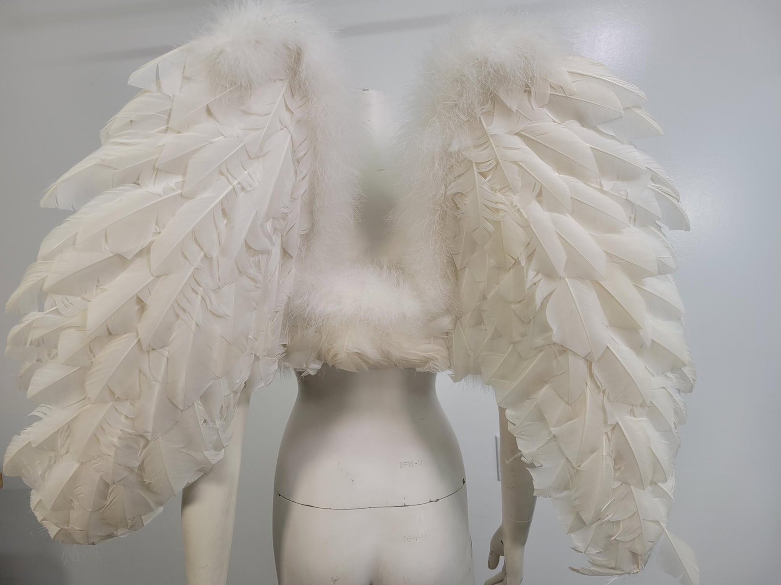 Mother Plucker Feather Co Angel Wings: Decription:Angel wings made by Mother Plucker Feather Co. attached with adjustable Velcro arm straps. Feathers have been ruffled (see photos)Measurements: 28" x 33"