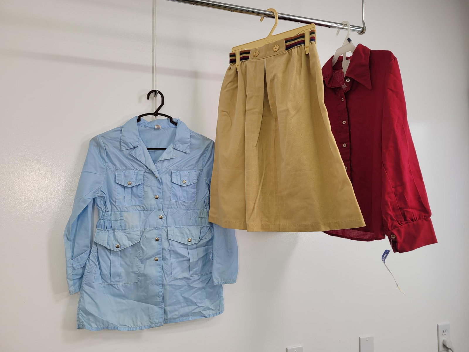 60s/70s Lot OF Girls Clothes: Description: red button down by white stag for girls with wide collar and tags. Windbreaker made in Taiwan, has some discoloration on front (see photos) Tan skirt with decorative waist band. Measureme