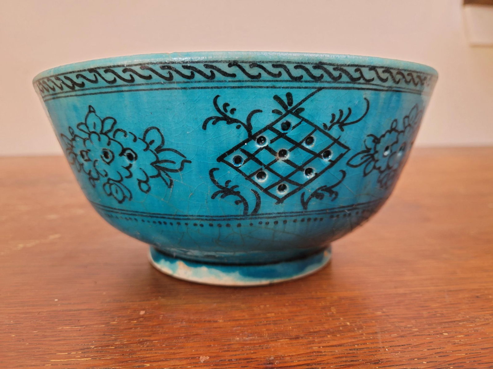 Hand Painted Iranian Bowl: The bowl features hand painted designs over a blue glazed bowl, vintage in age signed on bottom "Iran" Measurements: 8"W x 4"H Transport Fee $25