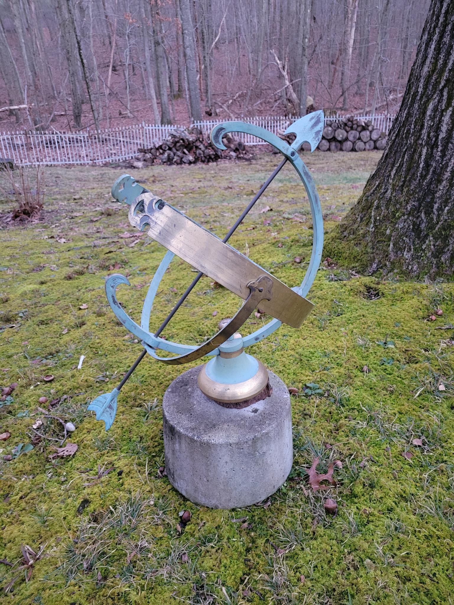 Vintage Brass Armillary on Concrete Base: The piece is in good vintage condition having been kept outdoors. Includes the concrete base if buyer would like to take it. Looks like it used to sit onto a wooden base which has rotted away.Measurem