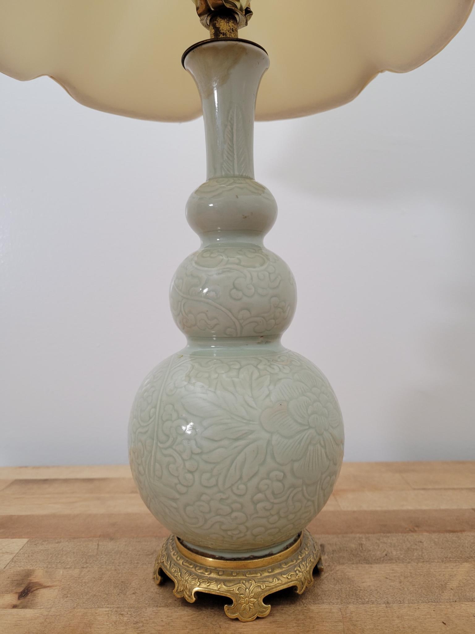 Mid-20th Century Celadon Porcelain Table Lamp: Lamp dates to the mid-20th century, finely made and in good working order. Measurements: 10"W x 22"H (Including Shade)