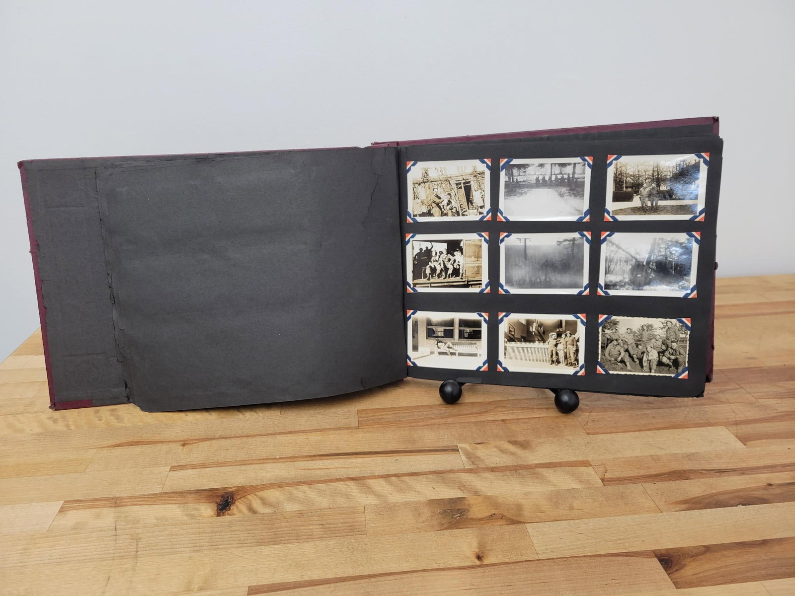 WWII American Photo Album of Nazi Germany: This lot includes a very unique photo album from a WWII vet depicting photographs taken while in Nazi Germany. Includes a rare photo of Nazi S.S. solders matching as POW's (First page, top center phot