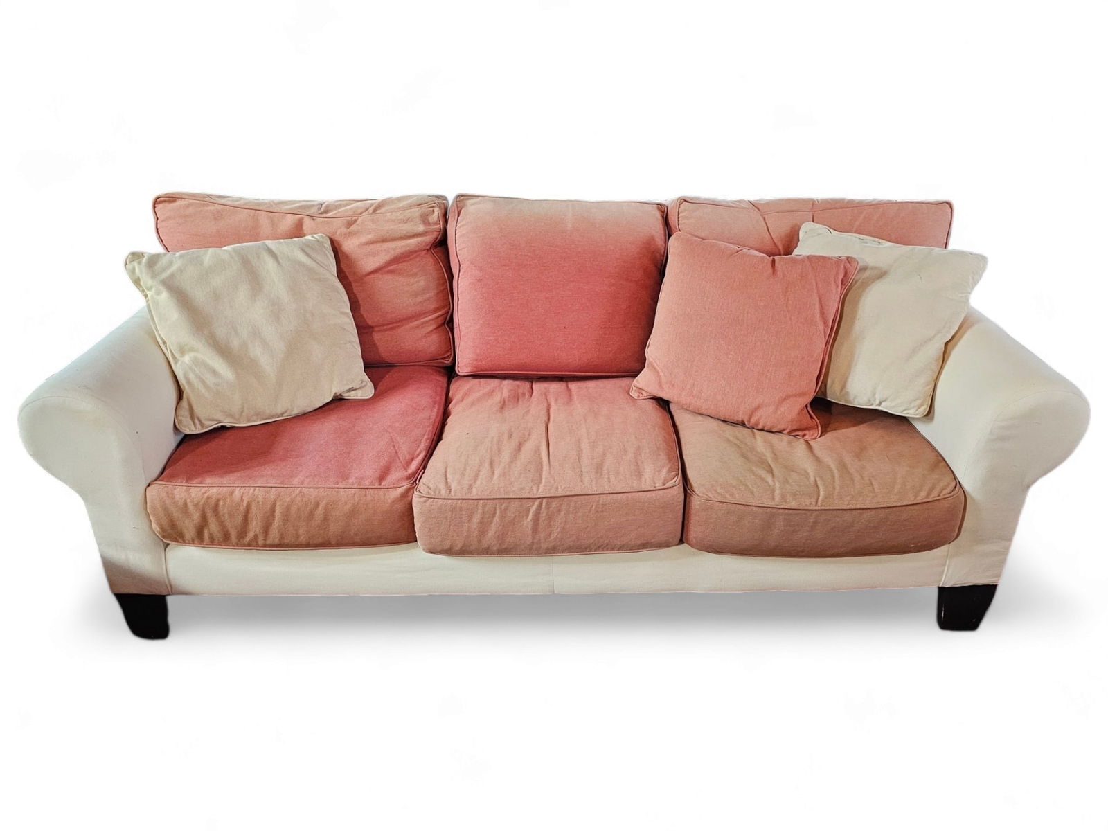 Upholstered Sofa By Vintage Metro Furnishings: Upholstered sofa by Vintage Metro Furnishings. sofa is upholstered in white with salmon colored cushions and matching slip cover (not photographed) Some color fading and light staining throughout Meas