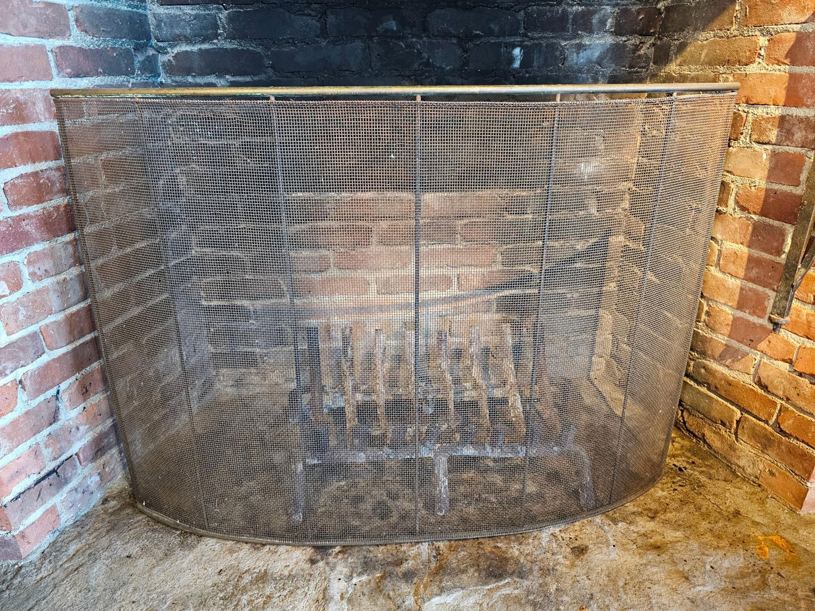 Large Fireplace Screen: Screen has a steel mesh mounted into a copper frame, unmarked 20th century in age. Overall it is in good used condition, some dents and defects should be expected. Measurements: 44"L x 4"D x 32"H Fee 