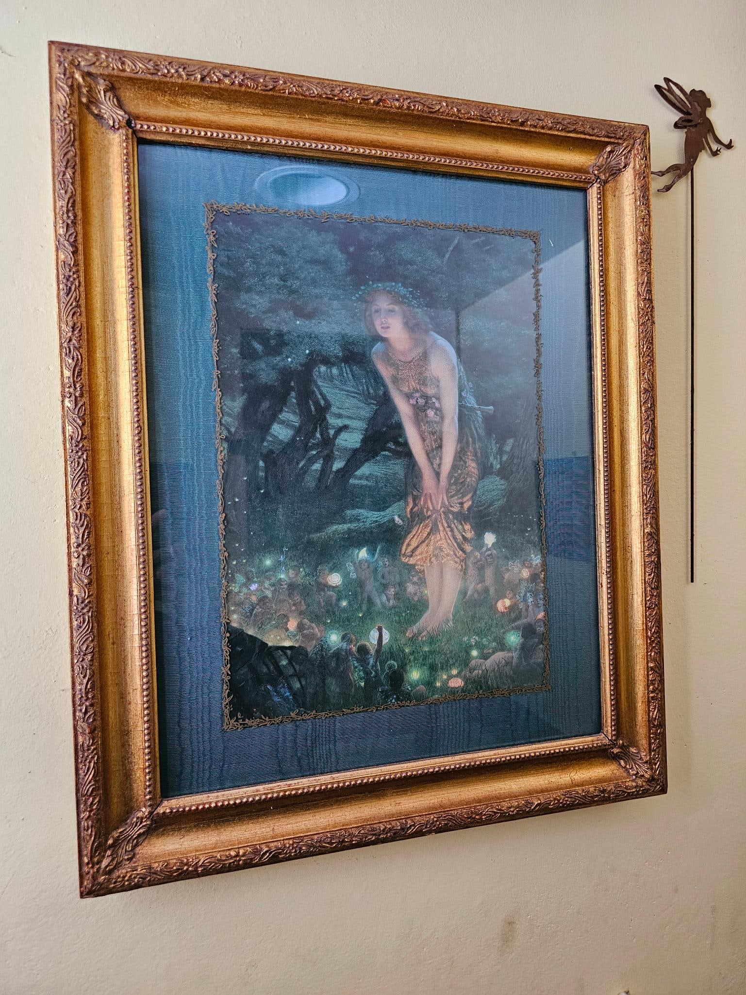 Hand-Done Framed Fairy Print, Signed on Reverse: This lot includes a unique print of a fairy in a forest. There is an artist label on the back describing that the gold boarder is hand painted, with a fabric matte and print mounted on fabric. We cann