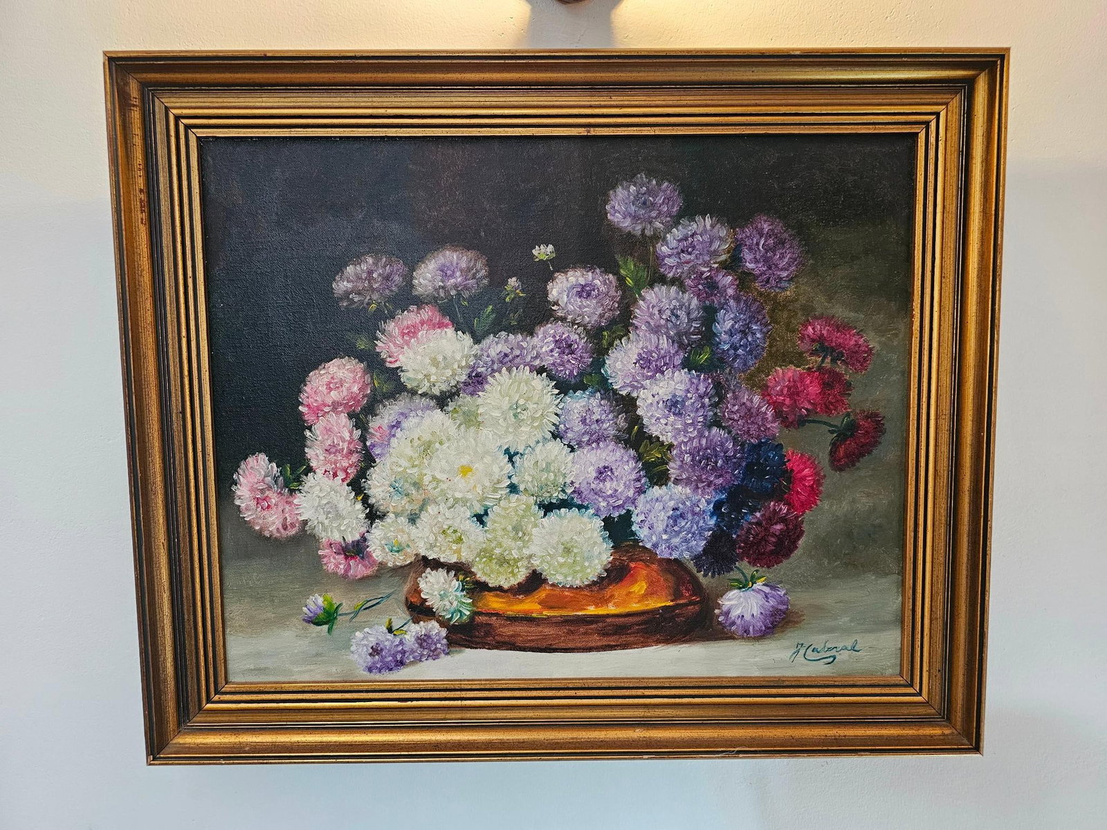 Floral Still Life Painting - Oil on Canvas: Painting is signed on lower right, however we cannot ID the artist. Still life of a grouping of flowers in a copper pot. Signature appears to read "Caberal", 20th century Measurements: 22.5"W x 18"H F