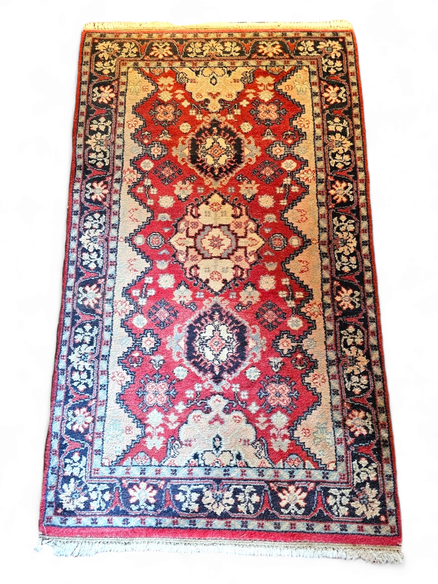 Hand Knotted Rug - 64" x 36": Rug is hand made and of good quality. All of the rugs were purchased at auctions throughout New England over the last 30 years. The condition of the rug is good, with minor fading and losses as expect