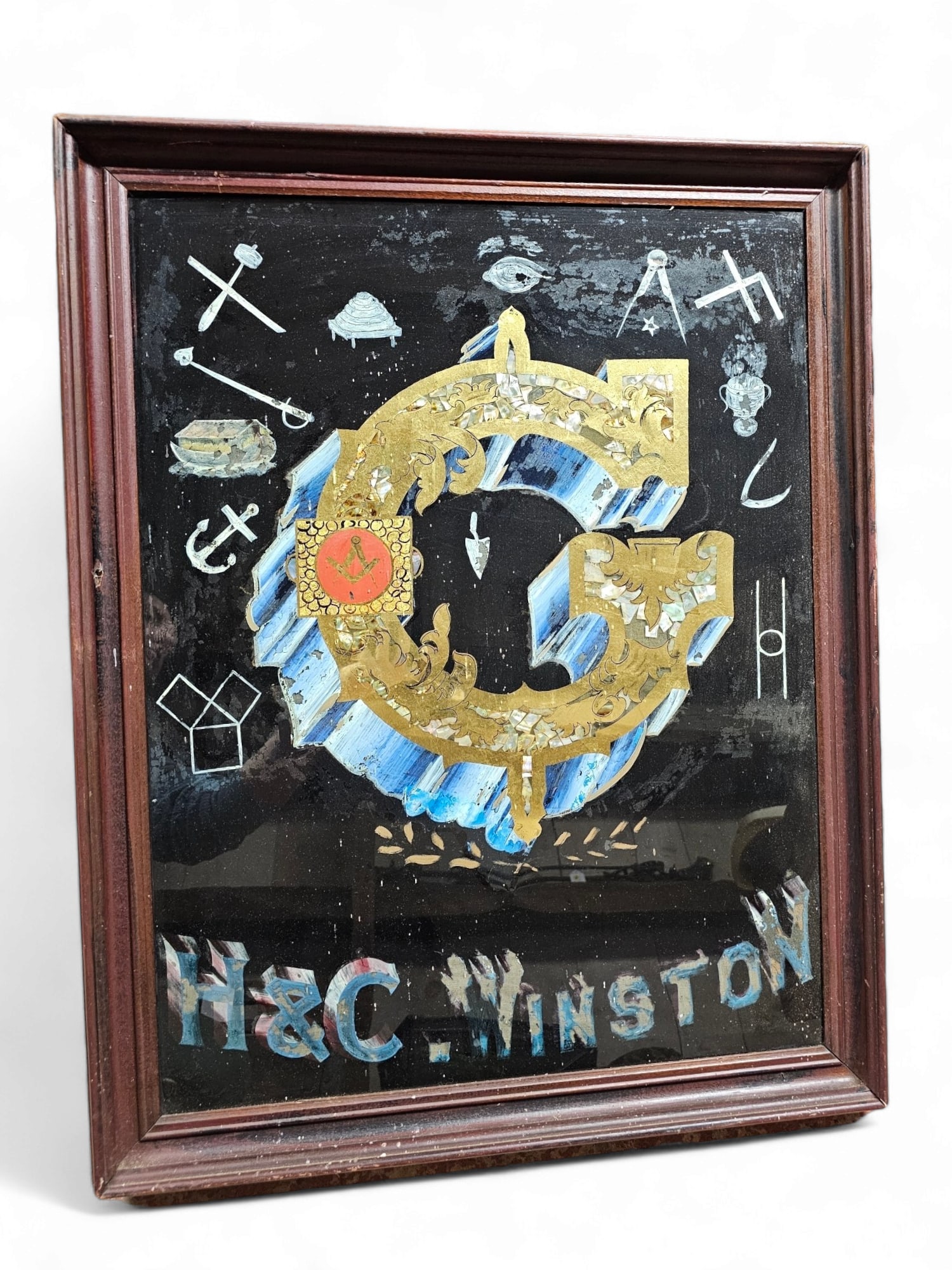 Unusual Masonic Reverse Painting on Glass: This lot includes a unique reverse painting on glass in a wooden frame. The painting is for the H & C Winston Lodge, the painting shows minor areas of loss but otherwise is in good antique condition. 