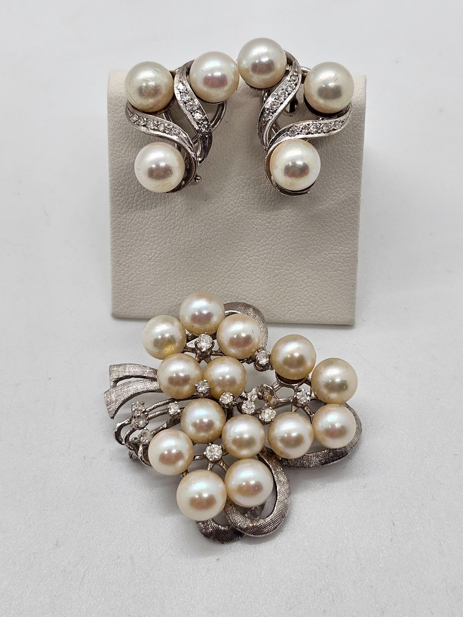 14k White Gold Pearl & Diamond Set: Lot includes a 14k white gold pearl and diamond broach with matching earrings. Each piece features a cluster of pearls mixed with diamonds. See photos for lot contents, conditions and details. Total w