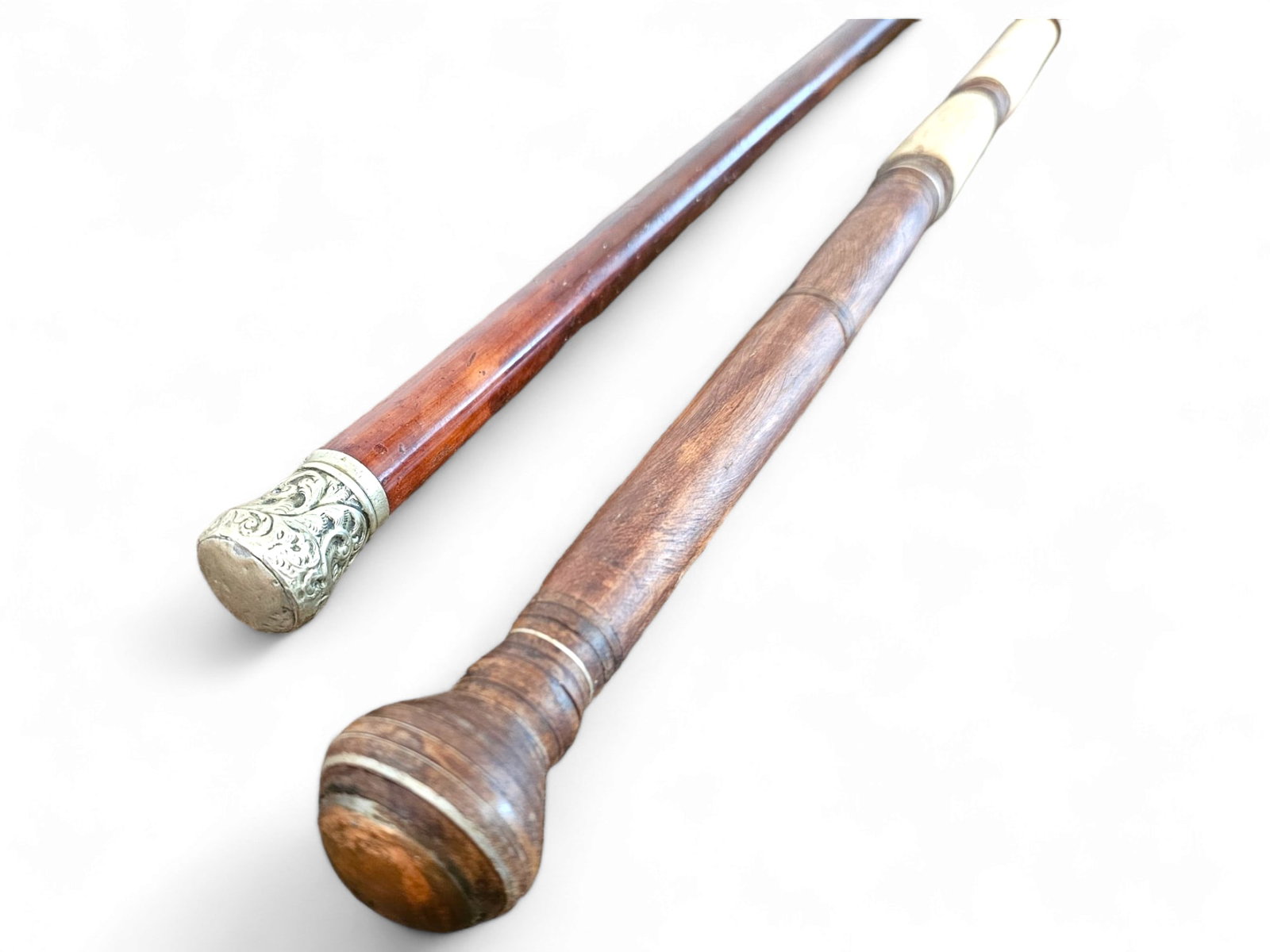 2 pc Lot of Antique Canes - Bones & Gold Plated: This lot includes a pair of antique canes, one with a turned wood top and bone inlaid shaft. The top of the second cane is engraved gold plate. See photos for lot details, and condition. Measurements: