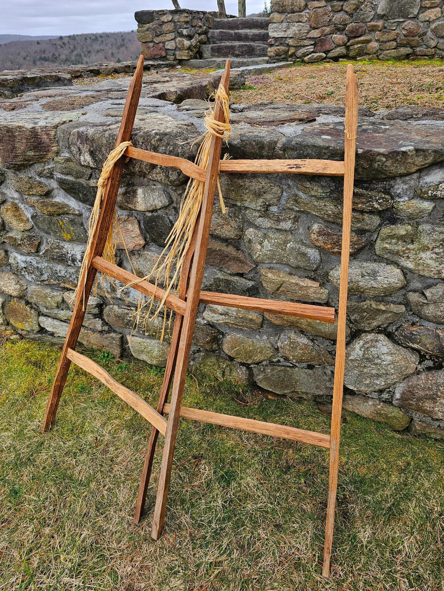 Primitive Wood Garden Stakes: This lot includes a pair of handmade wooden garden stakes, see lot photos for more details, and conditions. These appear antique in age.Measurements: 20.75"W x 48.75"HFee for Transport back to Oakvill