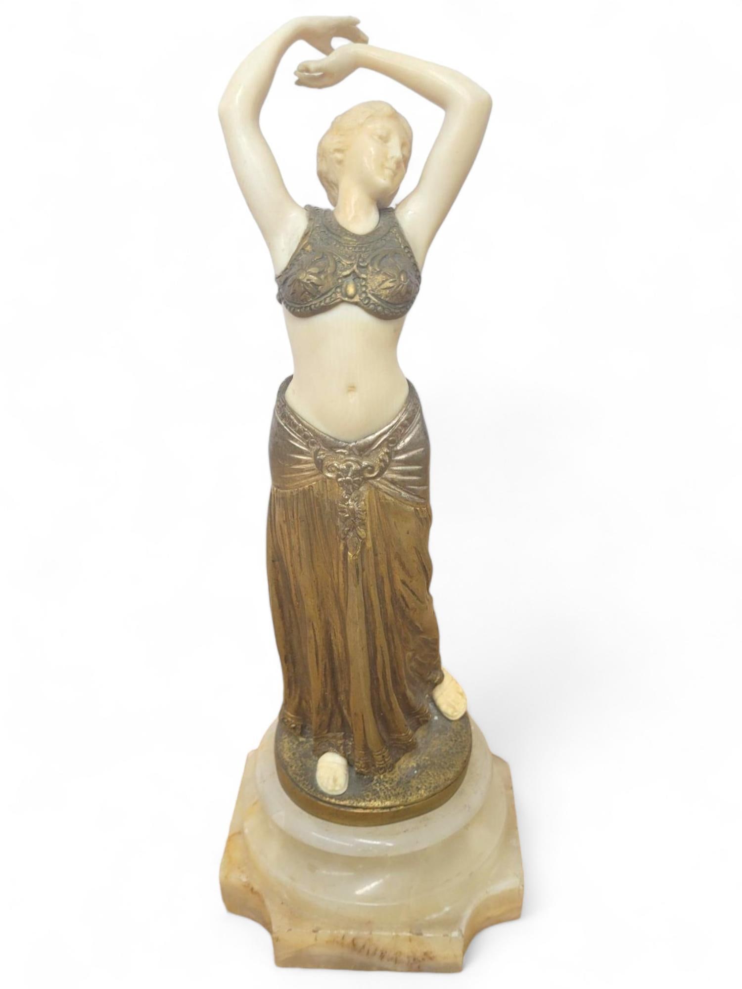 Theophile Somme (1871-1952) French Bronze Female: The bronze figure of a dancing female standing atop a onyx base. The figure has carved bone set into the bronze and very delicately done. Overall the piece is in good antique condition showing minimal
