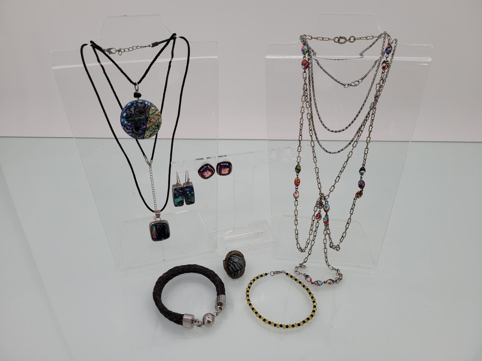 Lot Of Funky Colored Beads And Silver Jewelry: Description: Lot features multifaceted colored beads and pendants, bracelets, earrings and ring. One matching silver pendent and earrings set is a real showstopper (22.3g)
