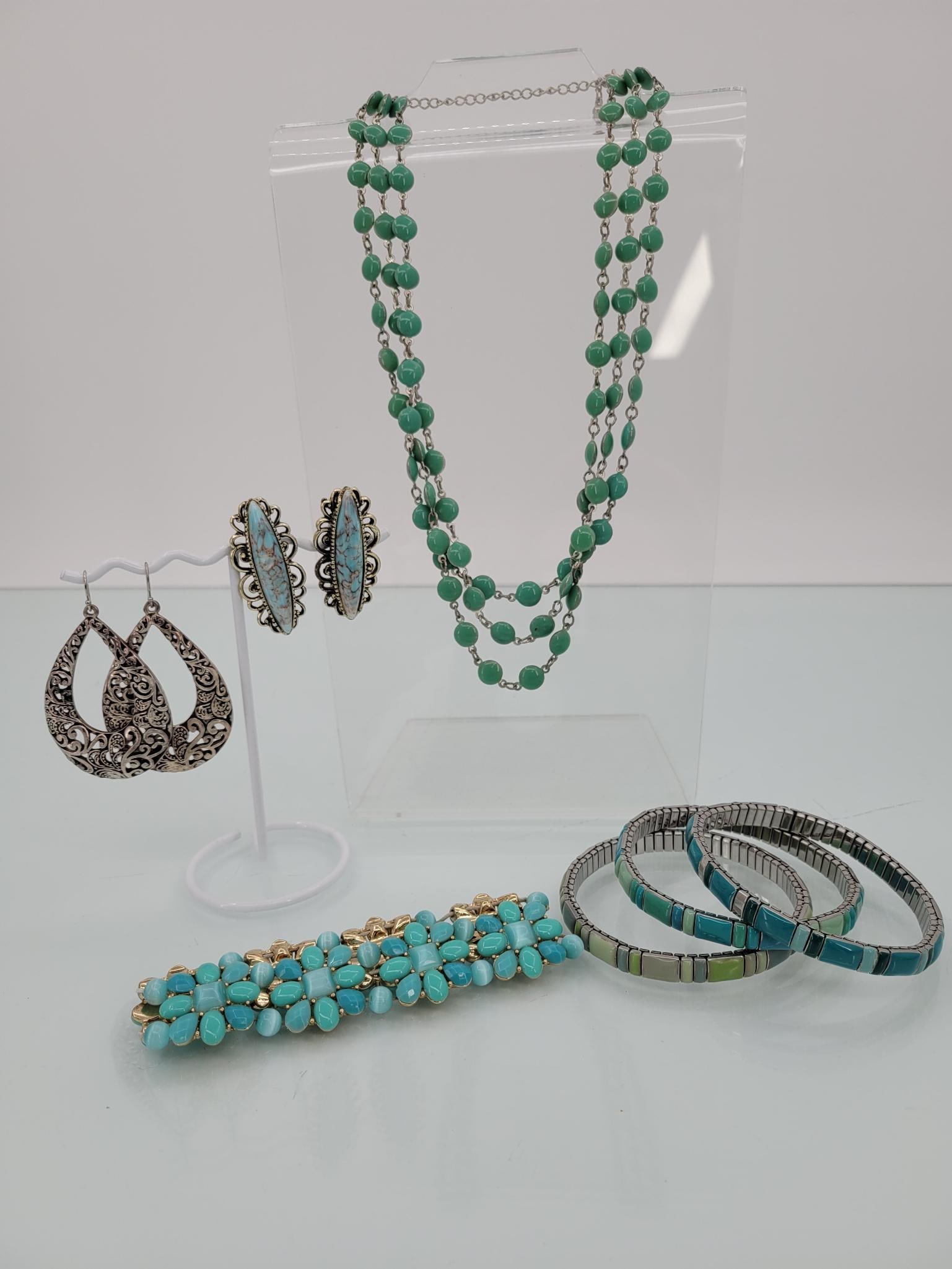 Cool Pastel Mixed Jewelry: Description: includes four bracelets, multi strand necklace, and two earrings (one clip and one hanging)