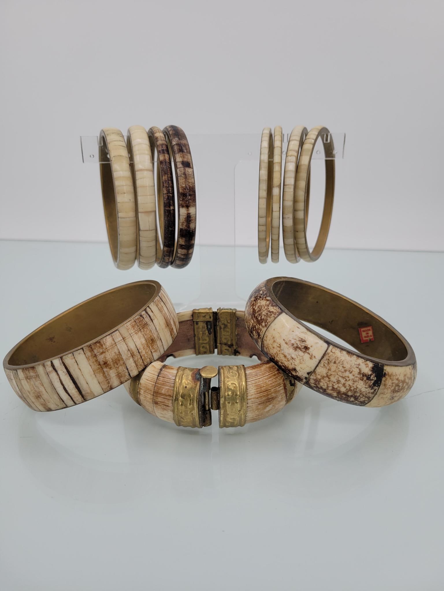 Brass And Bone Vintage Bangle Bracelets: Description: Vintage Indian made brass and bone bangle bracelets. Ten regular and one hinged with a neat sliding pin clasp