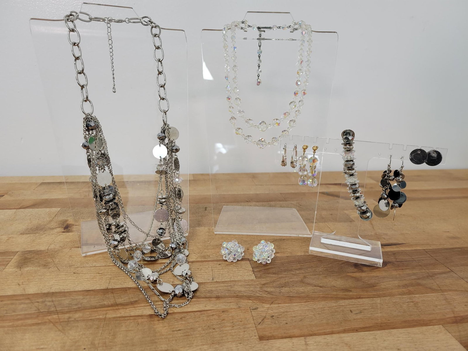 Crystal And Sequin Jewelry Lot: Description: lot includes long crystal and sequin necklace, a vintage double strand crystal necklace, crystal hanging post earrings, sequin pos earrings, hanging sequin earrings, mini hoops, crystal c