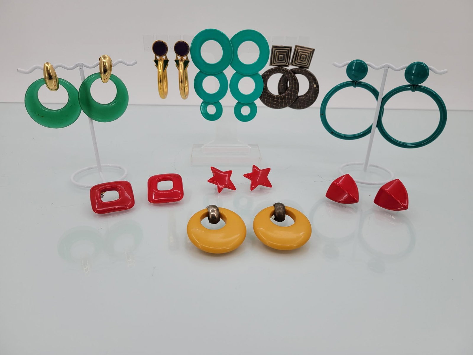 Nine Pairs Of Large 80s Statement Earrings: Description: super funky lot of nine huge pairs of pierced ear earrings. Some finish loss, to be expected with age and wear