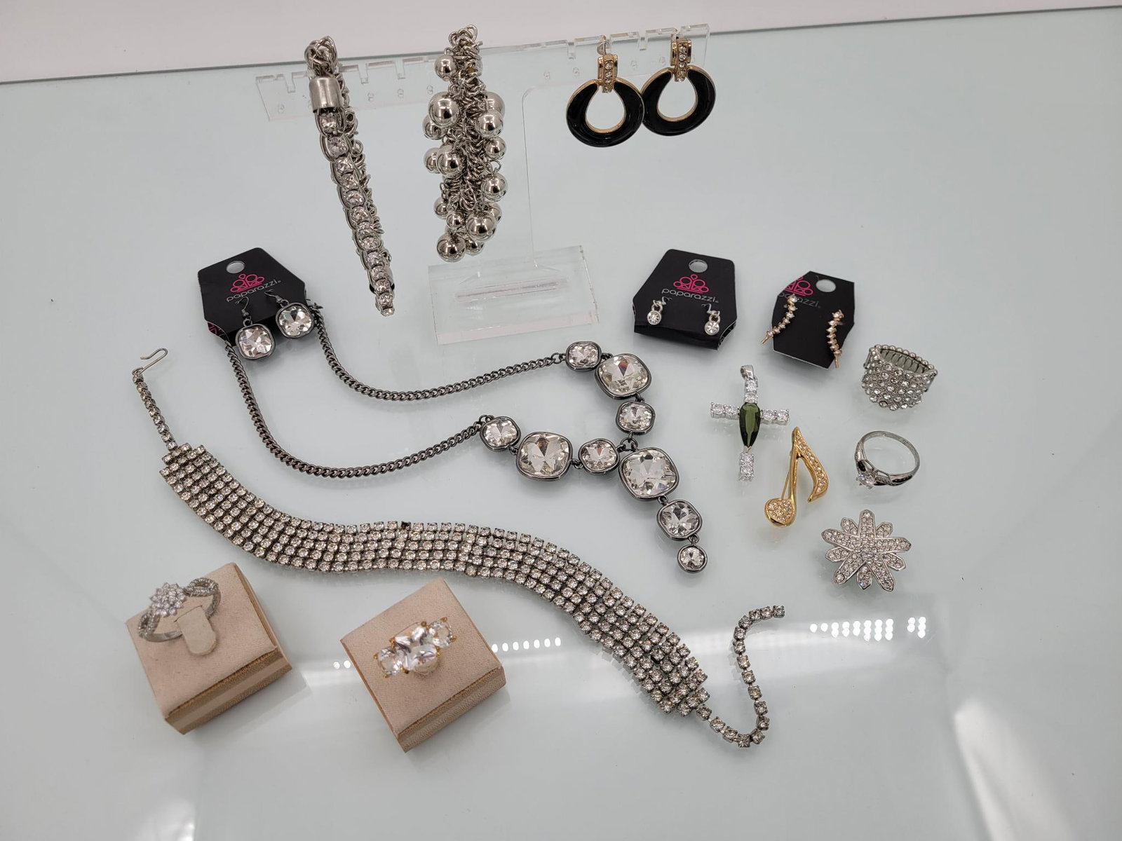 New And Vintage Silver And Gold Toned Glam Lot: Description: this lot is loaded with sparkle. Includes a new with tags paparazzi necklace and earring set, a vintage rhinestone choker (choker is missing a stone, see photos) two hanging new with tags