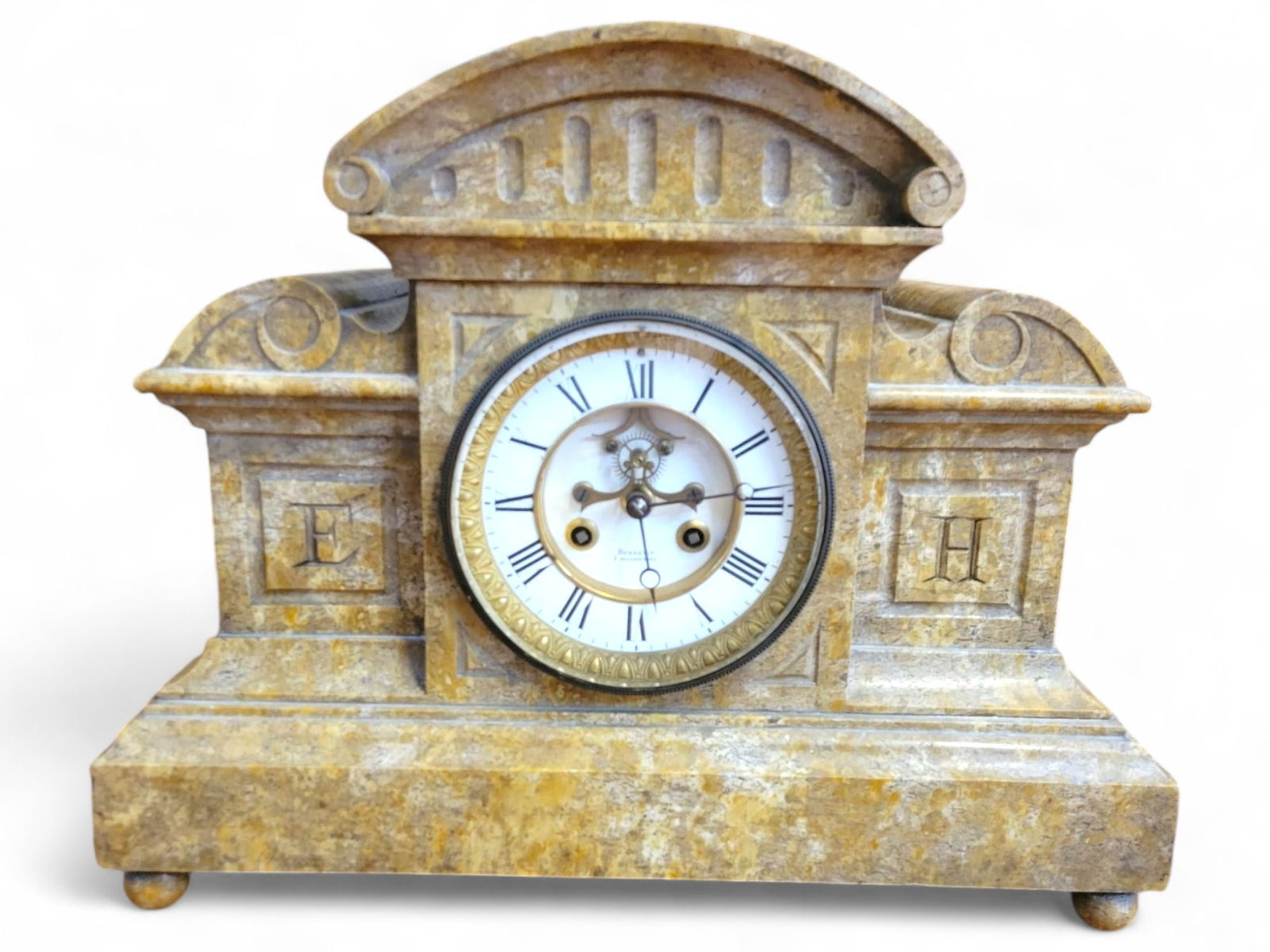 Large 19th Century French Marble Mantel Clock: This 19th-century French mantel clock is crafted from marble with carved details and a porcelain dial. The clock is housed in a rectangular case with columns on either side. The dial features Roman nu
