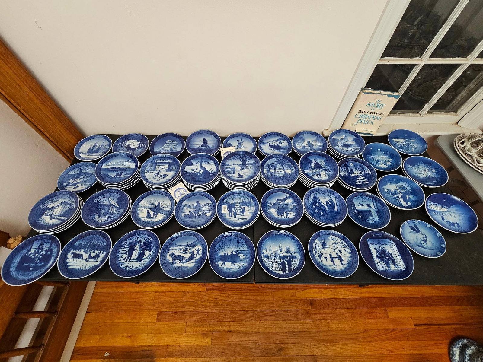 Massive Collection of 92 Royal Copenhagen Plates: This lot includes a massive collection of Royal Copenhagen Christmas collectors plates. In total there are 92 pieces, and is almost a complete set from 1960 - 1989. These are all in good condition, we