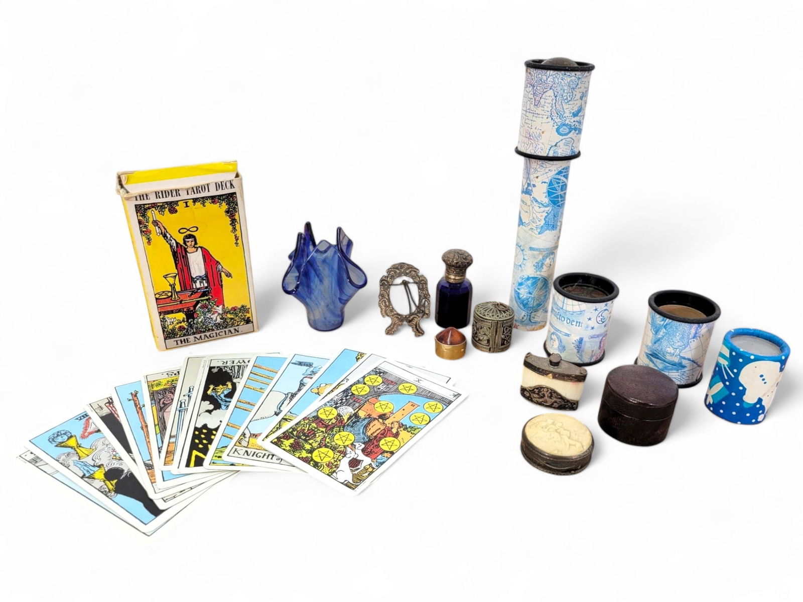 Vintage Collectible Objects and Tarot Set: A collection of vintage items, including a Rider Tarot Deck, miniature decorative boxes, kaleidoscopes, a cobalt glass vase, and small accessories. Good condition with some wear on the tarot box and i