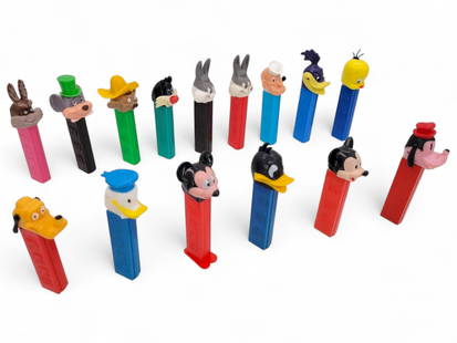 15pc. Vintage Looney Tunes & Disney Pez: 15pc. Lot of vintage Looney Tunes and Disney Pez dispensers. Each dispenser is in good estate found condition. 14/15 dispensers have no feet. Manufacturer locations and ages vary. See photos for detai