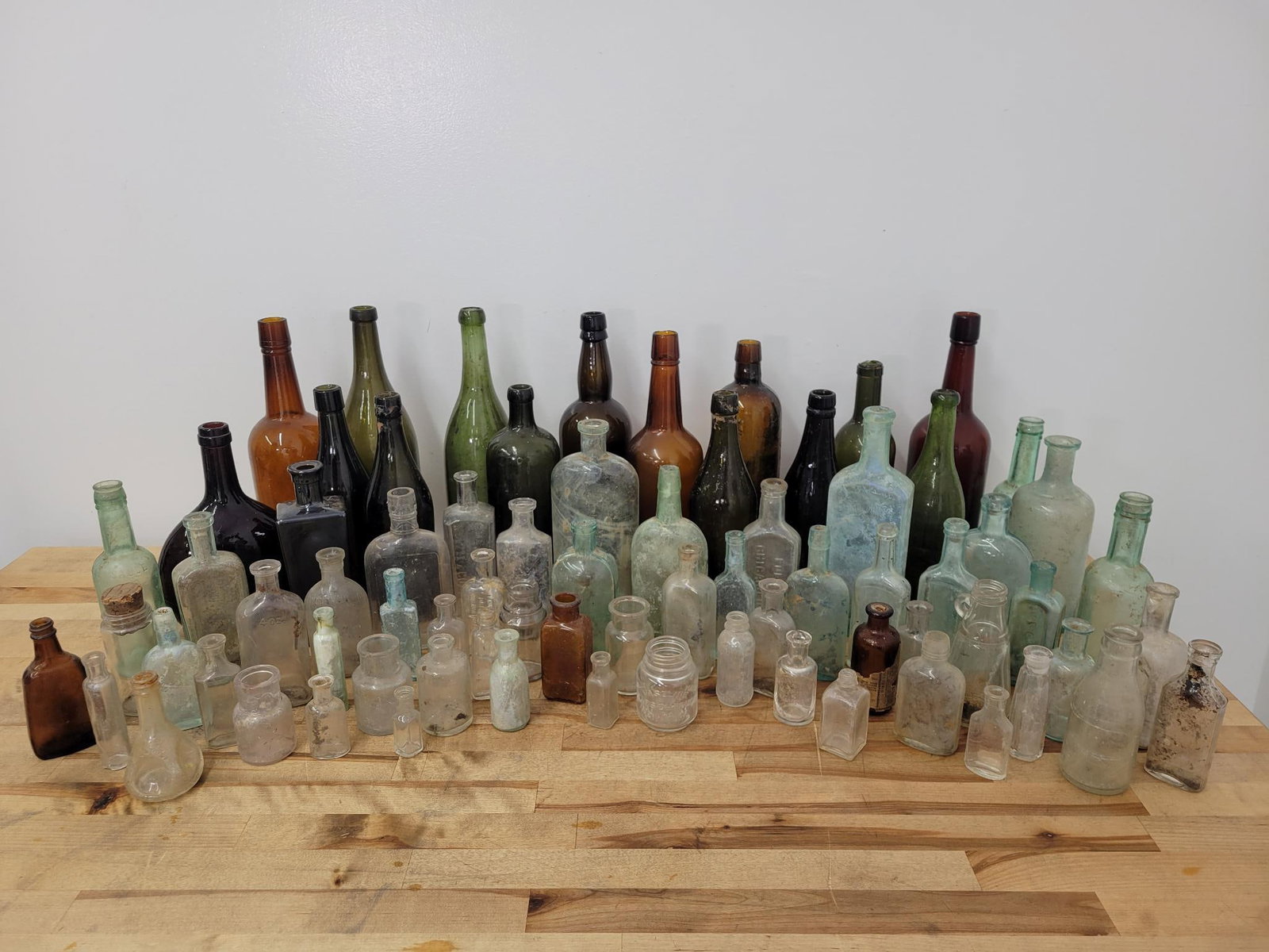 Large Lot of Bottles Offered Estate Found: This lot includes an assortment of estate found bottles of various ages, styles, and types. See lot photos for more information on the lots content, conditions, and details. Measurements: 