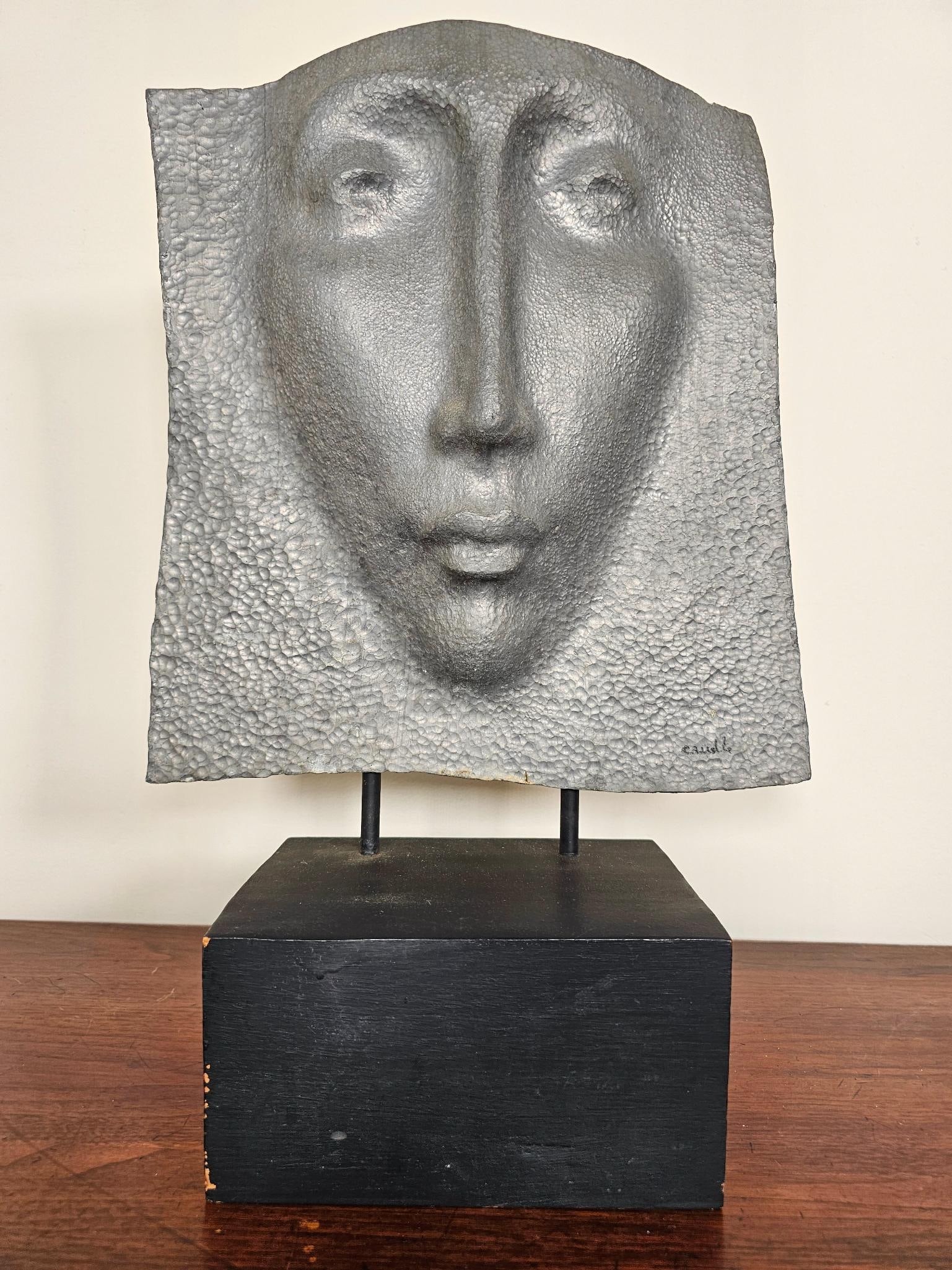Signed James R. Caudle (American 1920-2010) Lead Face Sculpture: James Richard Caudle (American, 1920 - 2010) Sculpture of face in lead on painted wood stand The sculpture is in good vintage condition showing a face impressed into lead with a hammered finish. 