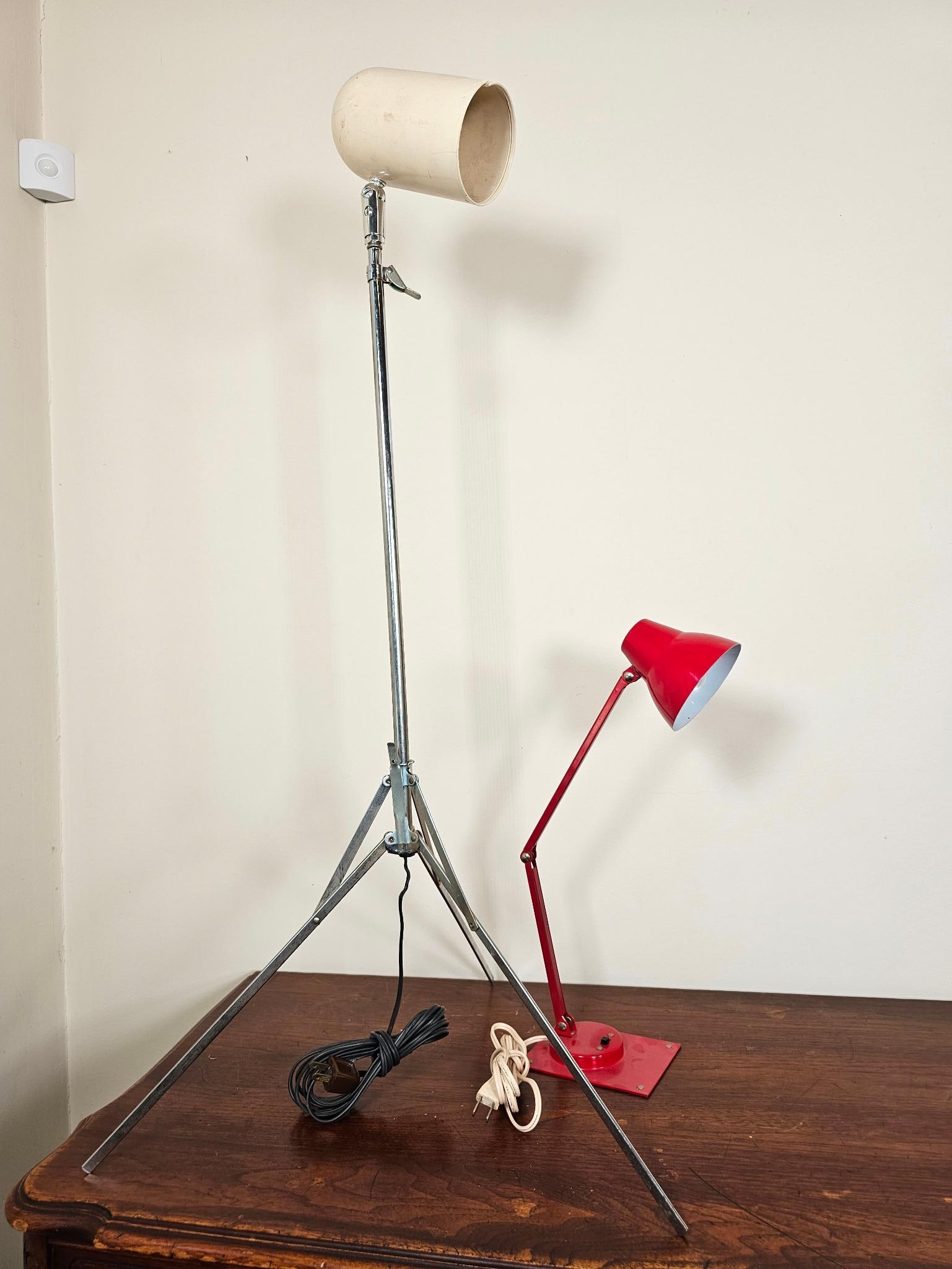 Pair of Vintage Mid-Century Desk / Table Lamps: This lot includes a pair of vintage mid-century lamps of various styles. The larger adjustable lamp has a crack in the shade, the other red lamp is in good overall vintage condition. See lot photos fo
