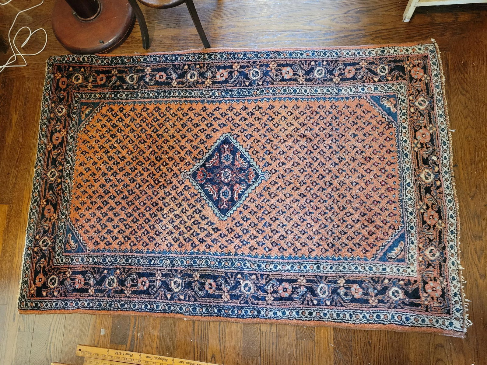 Antique Persian Rug - 59" x 39": This lot includes a 20th century Persian rug, the rug is in good antique condition with minimal ware as expected with age and use. From a pet free child free home, see lot photos for more detail